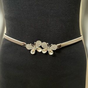 Silver tone metallic skinny belt with butterfly buckle